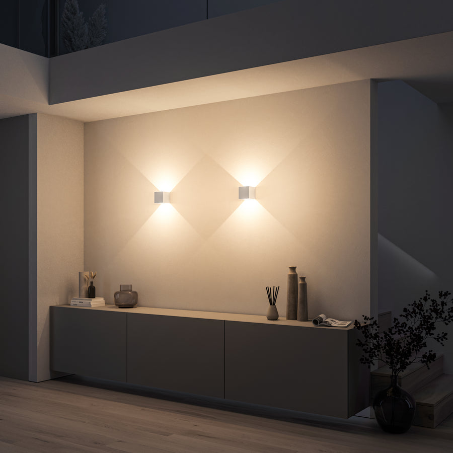 Wall lamp in a hallway or entryway, warm accent light, tidy look (portrait)